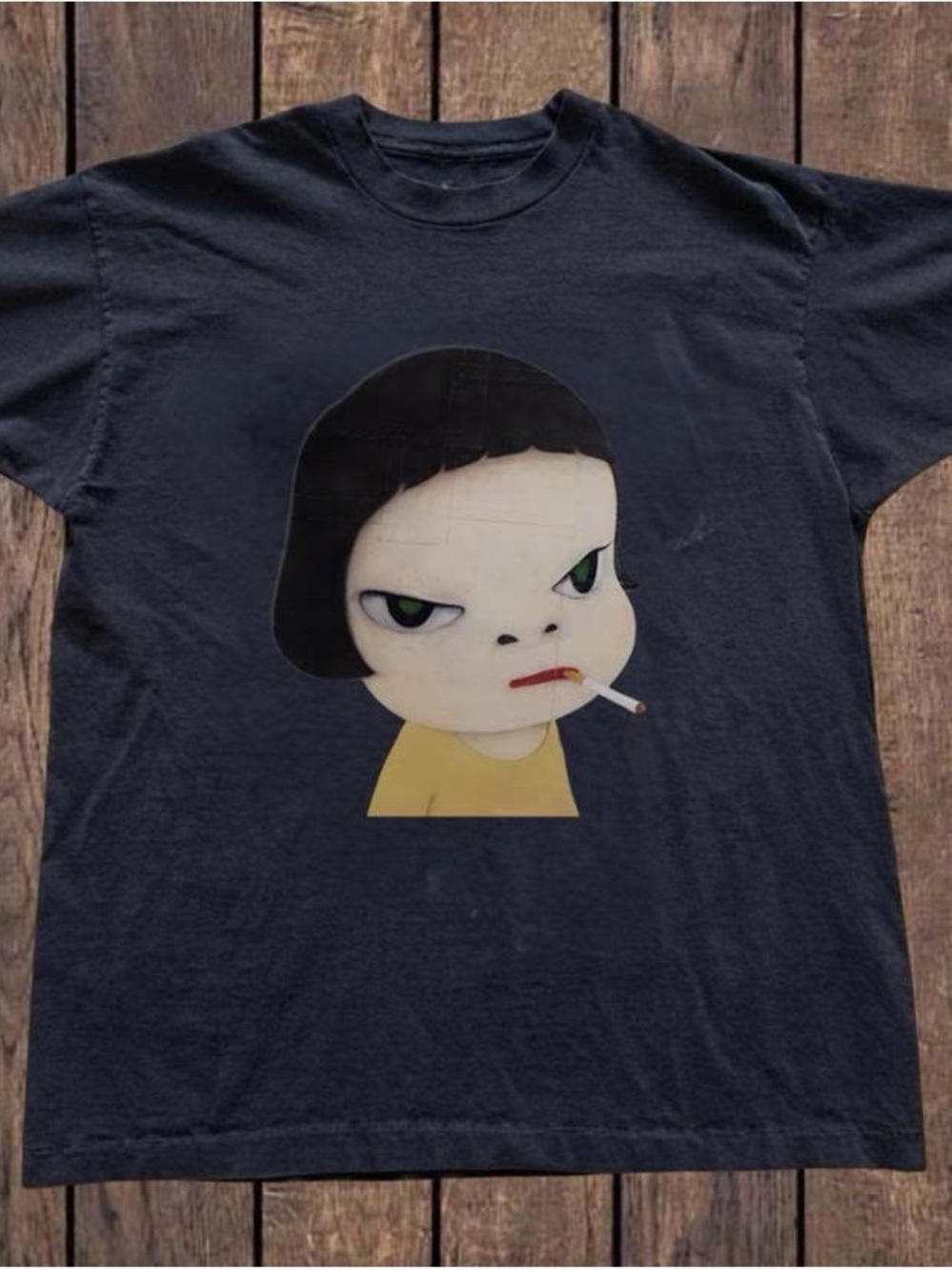 Black Tee with Yellow Graphic and Green Eye Details